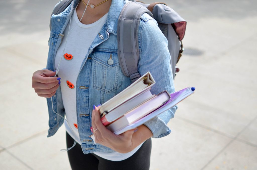 university student holding books