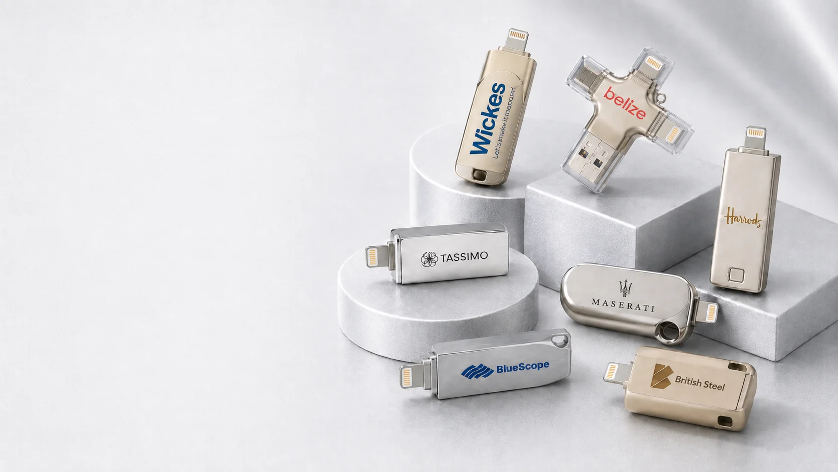 Branded Lightning and USB iPhone flash drives on stone plinths